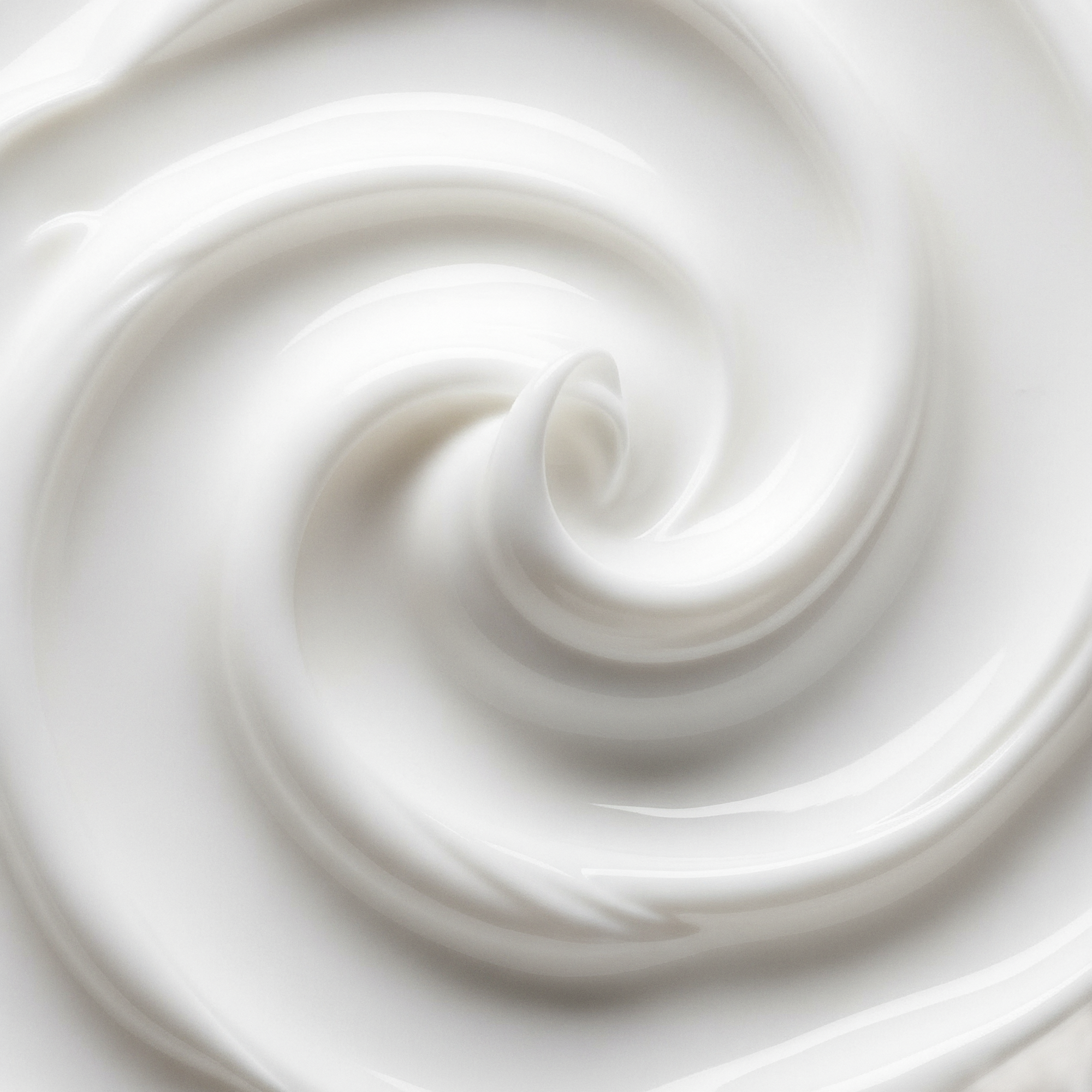 Close-up of a swirl of white cream or yogurt